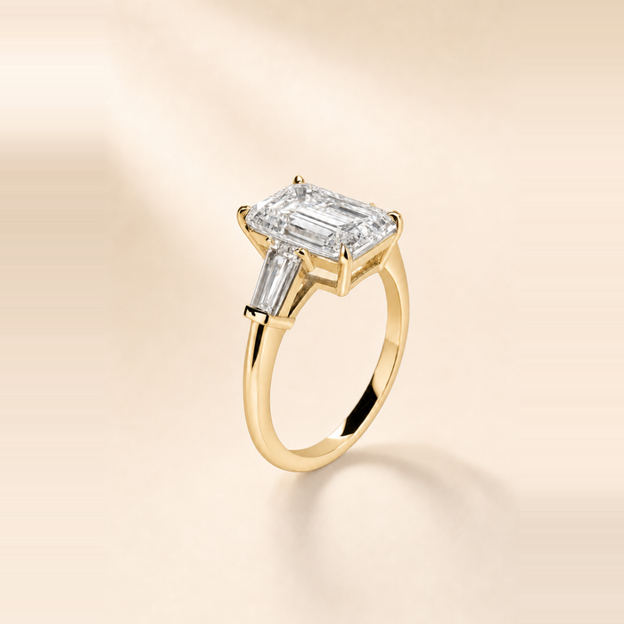 Emerald Three Stone Diamond with Tapered Baguette Side Stones