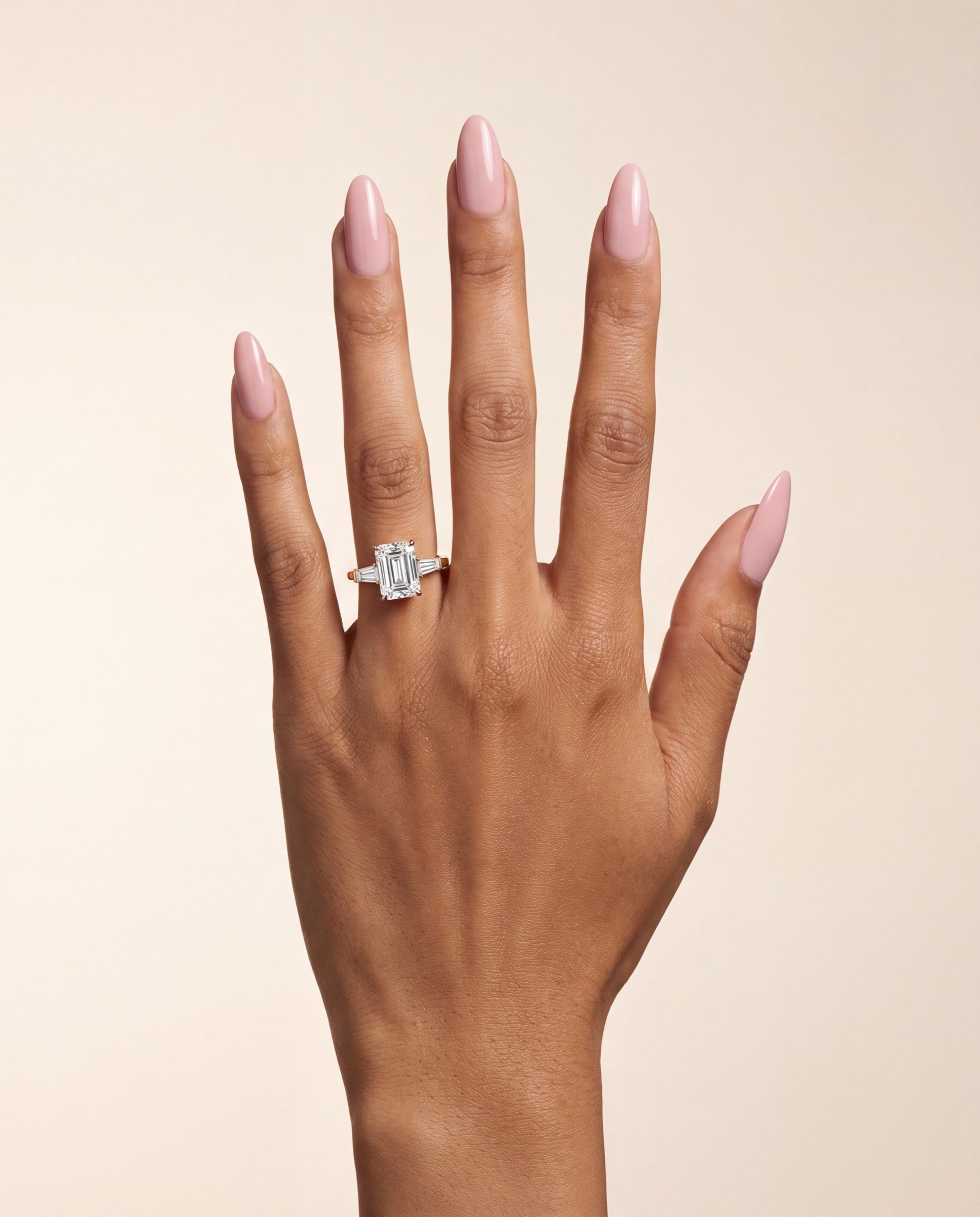 Emerald Three Stone Diamond with Tapered Baguette Side Stones &mdash; Worn